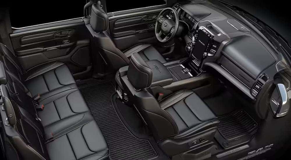 The black interior and dash is shown in a 2024 Ram 1500.