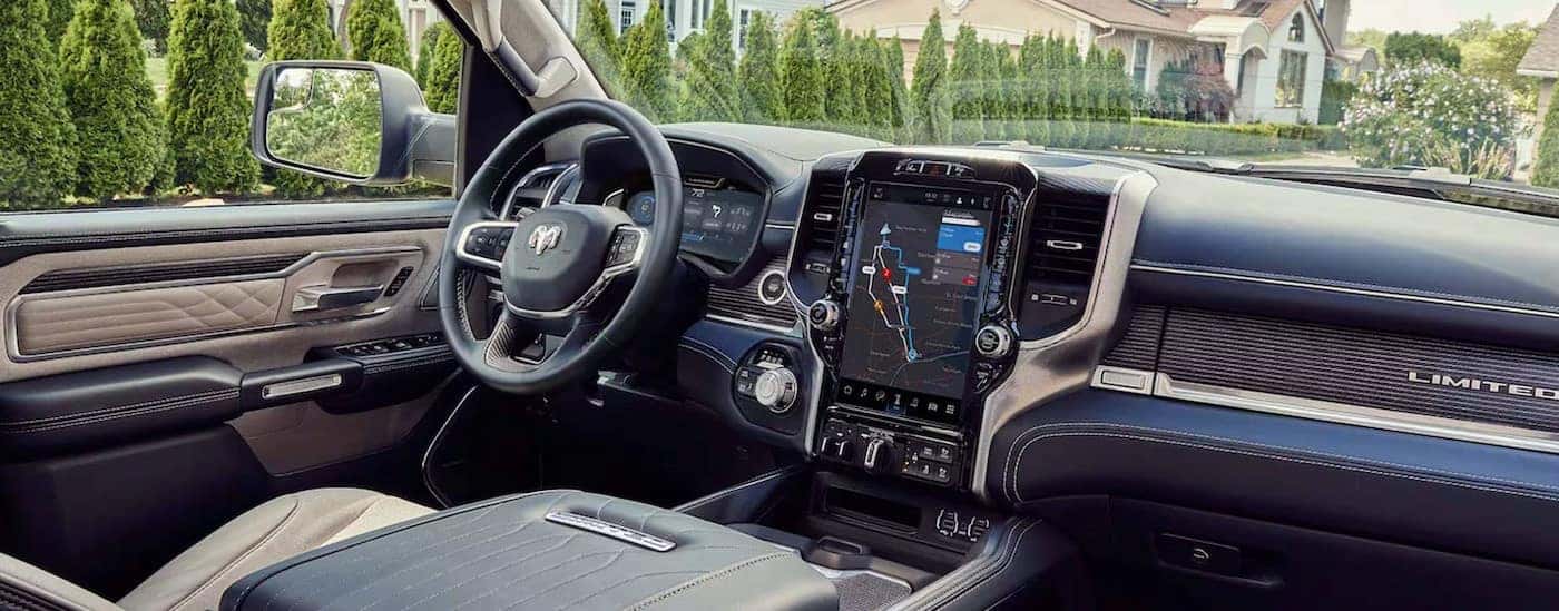 The black and white interior and dash in a 2024 Ram 1500 Limited is shown.