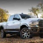 A white 2020 Ram 2500 is shown parked off-road after viewing used Ram trucks for sale.