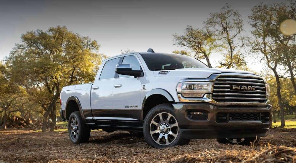 A white 2020 Ram 2500 is shown parked off-road after viewing used Ram trucks for sale.