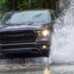 A grey 2023 Ram 1500 Warlock Edition is shown going to look at used trucks for sale.