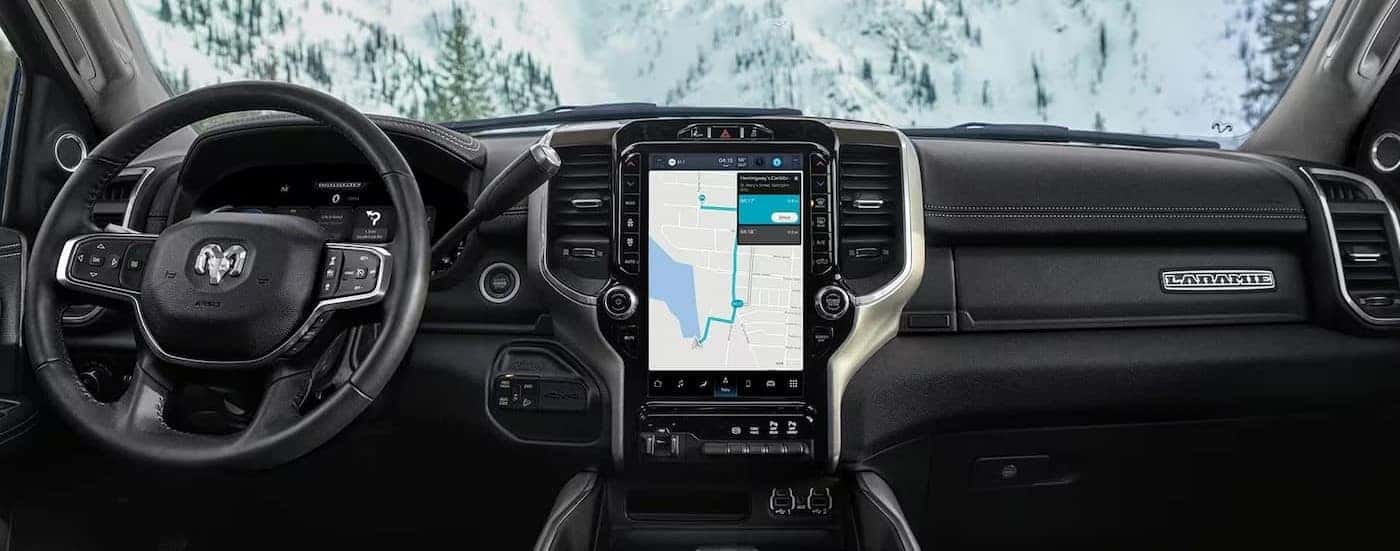 The black dash is shown in a 2023 Ram 2500 Laramie.