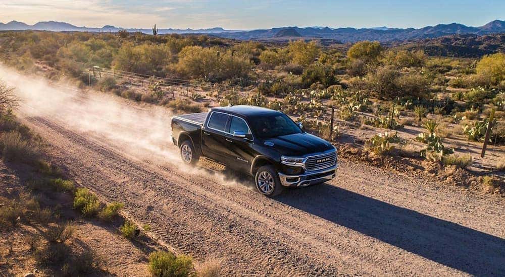 A grey 2019 Ram 1500 is shown from the front at an angle after leaving a dealer that has used trucks for sale near Cincinnati.