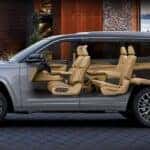 A grey x-ray view of a 2025 Jeep Grand Cherokee-L in a driveway.