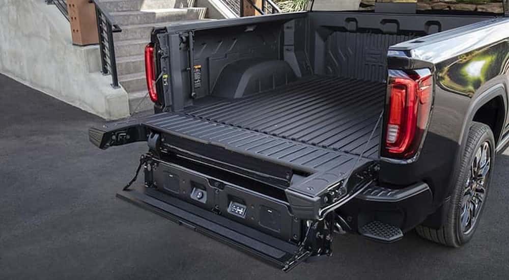 The bed and tailgate is shown on a black 2024 GMC Sierra 1500 Denali.