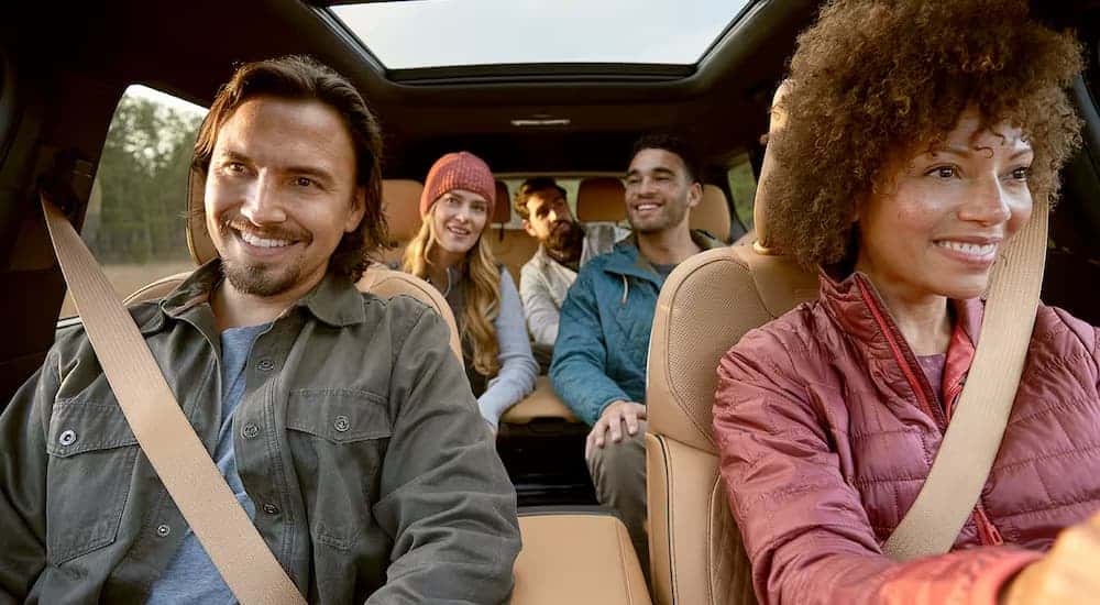 A group of friends are driving a 2025 Jeep Grand Cherokee L to a Jeep dealer near Lawrenceburg.