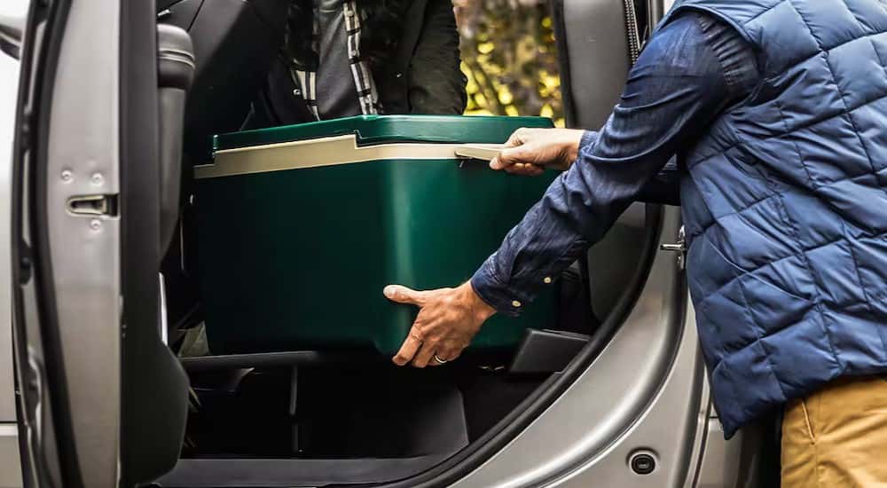The fold flat storage is shown in a 2024 Ram 2500.