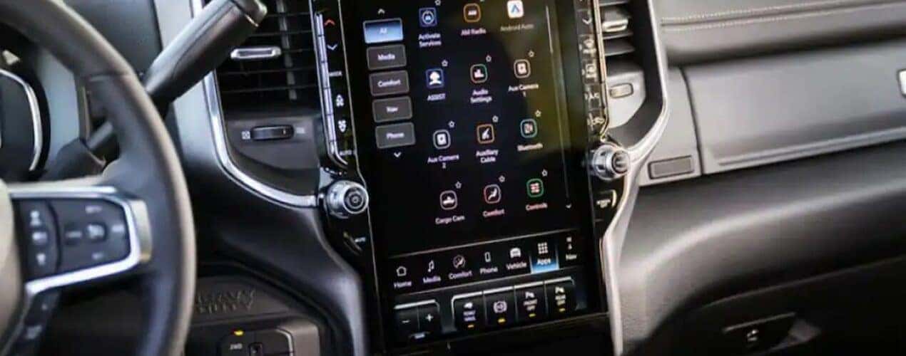 The close-up of the infotainment screen is shown in a 2025 Ram 2500.