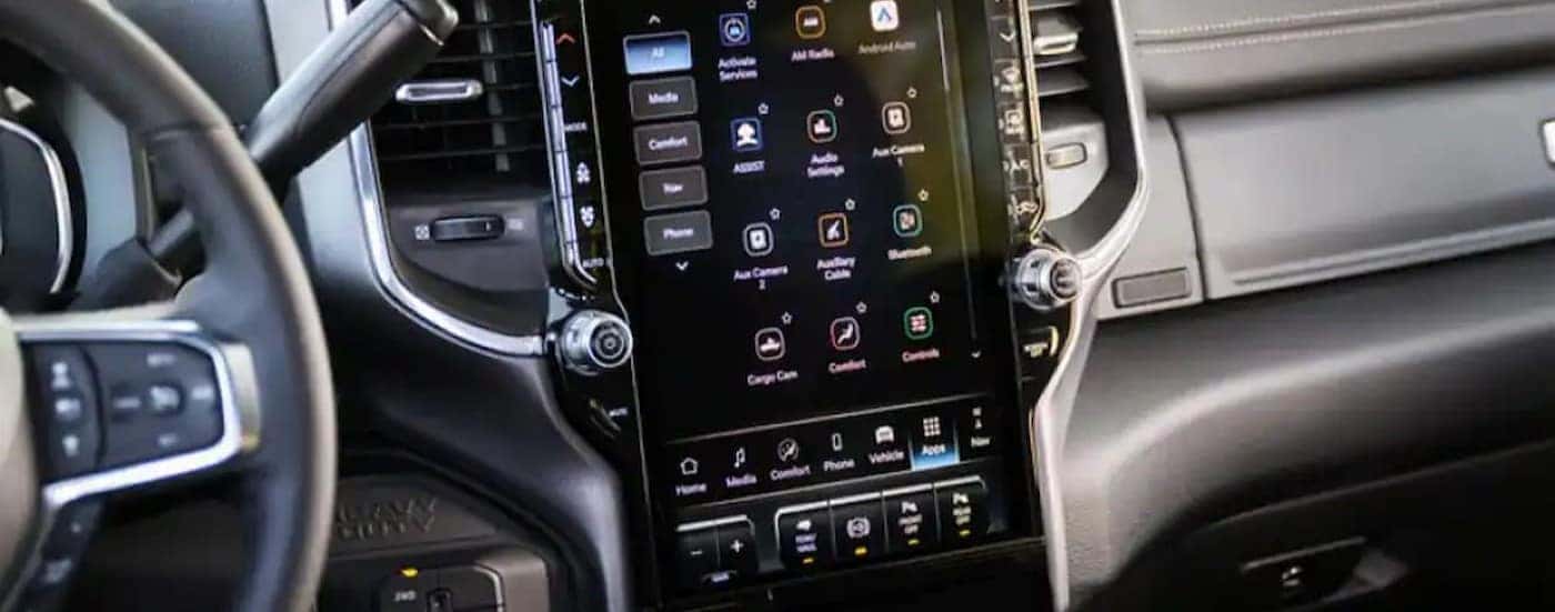 A close-up of the infotainment screen is shown in a Ram 2500 for sale in Florence.