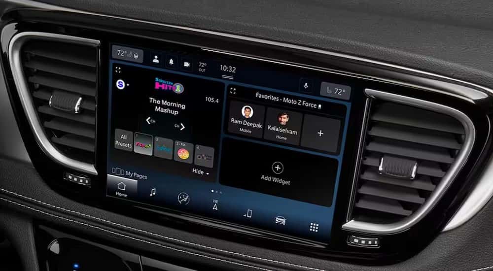 A close-up of the infotainment screen is shown in a 2025 Chrysler Pacifica.
