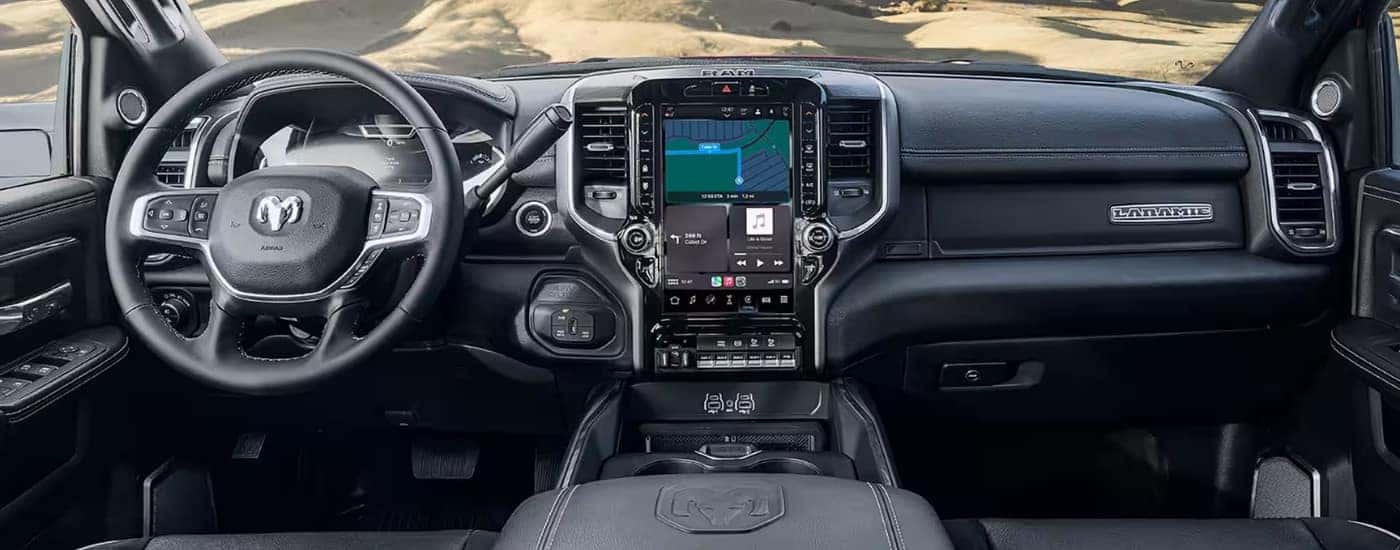 The black dash and infotainment screen in a 2025 Ram 2500 Laramie.