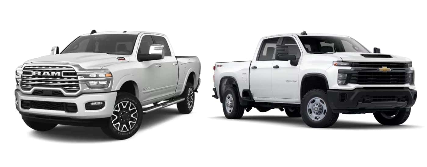 A white 2025 Ram 2500 and 2025 Chevy Silverado 2500 HD are facing opposite directions.