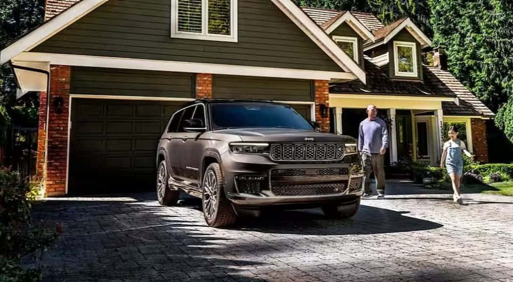 A black 2025 Jeep Grand Cherokee L for sale near Cincinnati parked on a driveway.