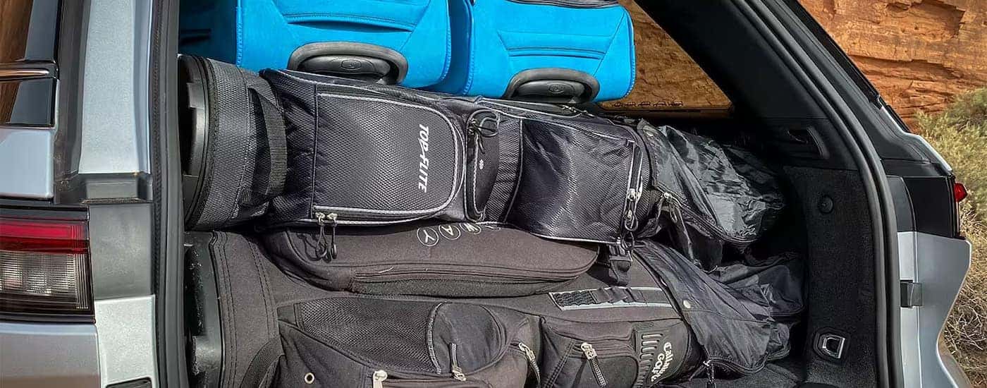 Golf clubs and luggage in the back of a 2025 Jeep Grand Cherokee L.