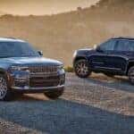 Two 2025 Jeep Grand Cherokee parked off-road
