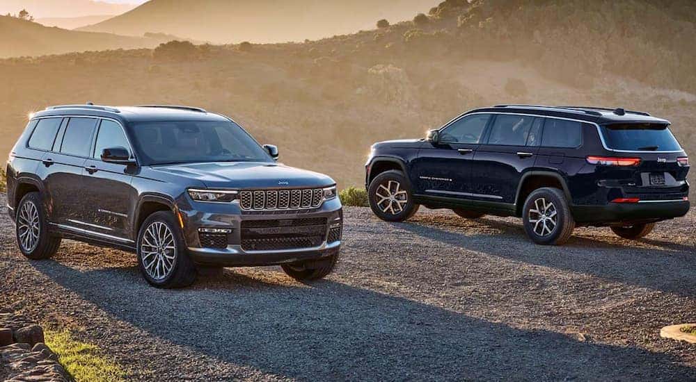 Two 2025 Jeep Grand Cherokee parked off-road