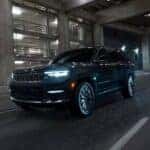A black 2025 Jeep Grand Cherokee for sale near Cincinnati driving at night.