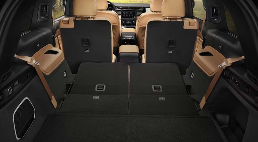 The tan interior of a 2025 Jeep Grand Cherokee L from the rear.