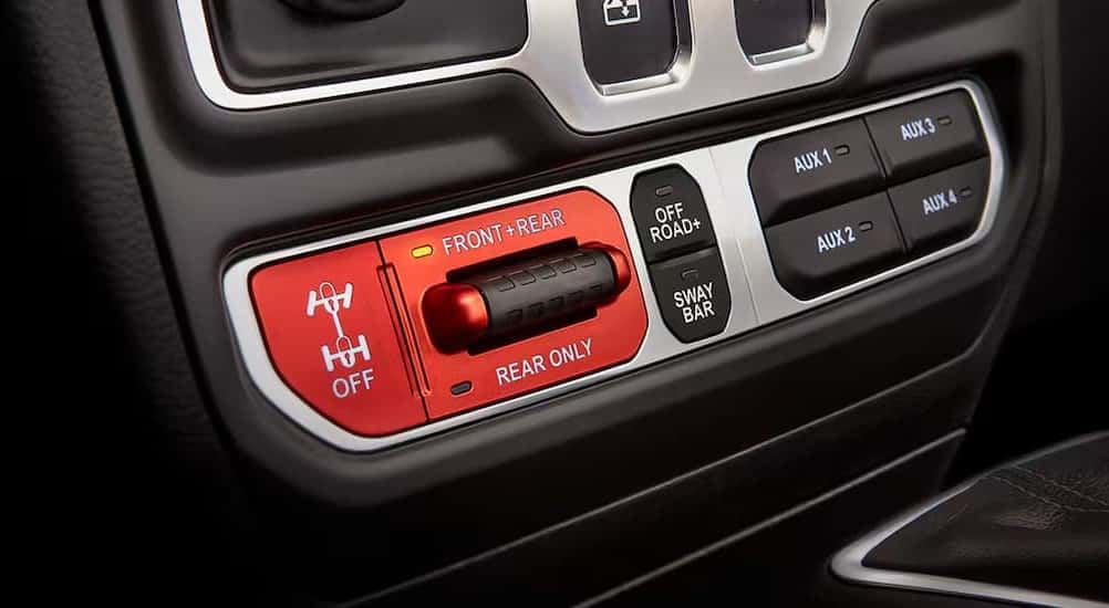 Close-up of the electronic locking differential buttons in a 2025 Jeep Wrangler.