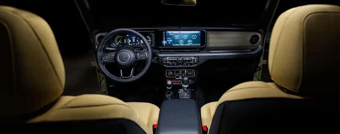 The black and tan interior and dash in a 2025 Jeep Wrangler.