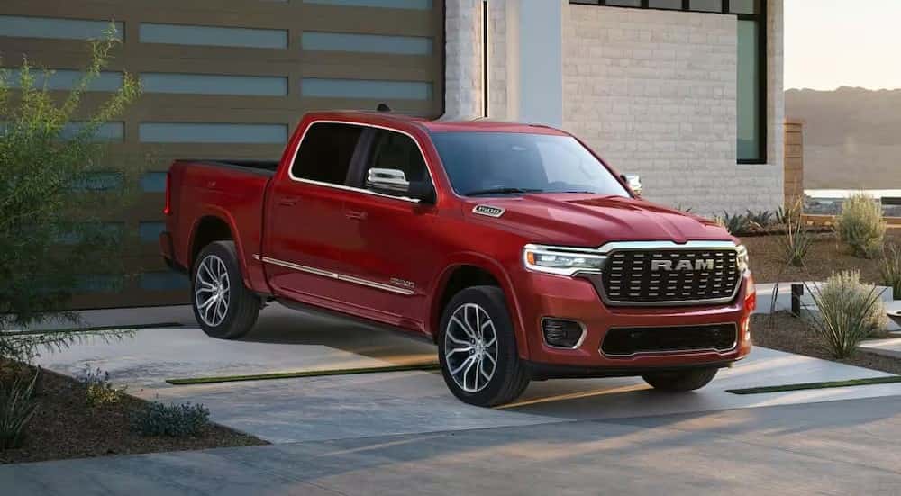 A red 2026 Ram 1500 for sale near Covington parked on a driveway.