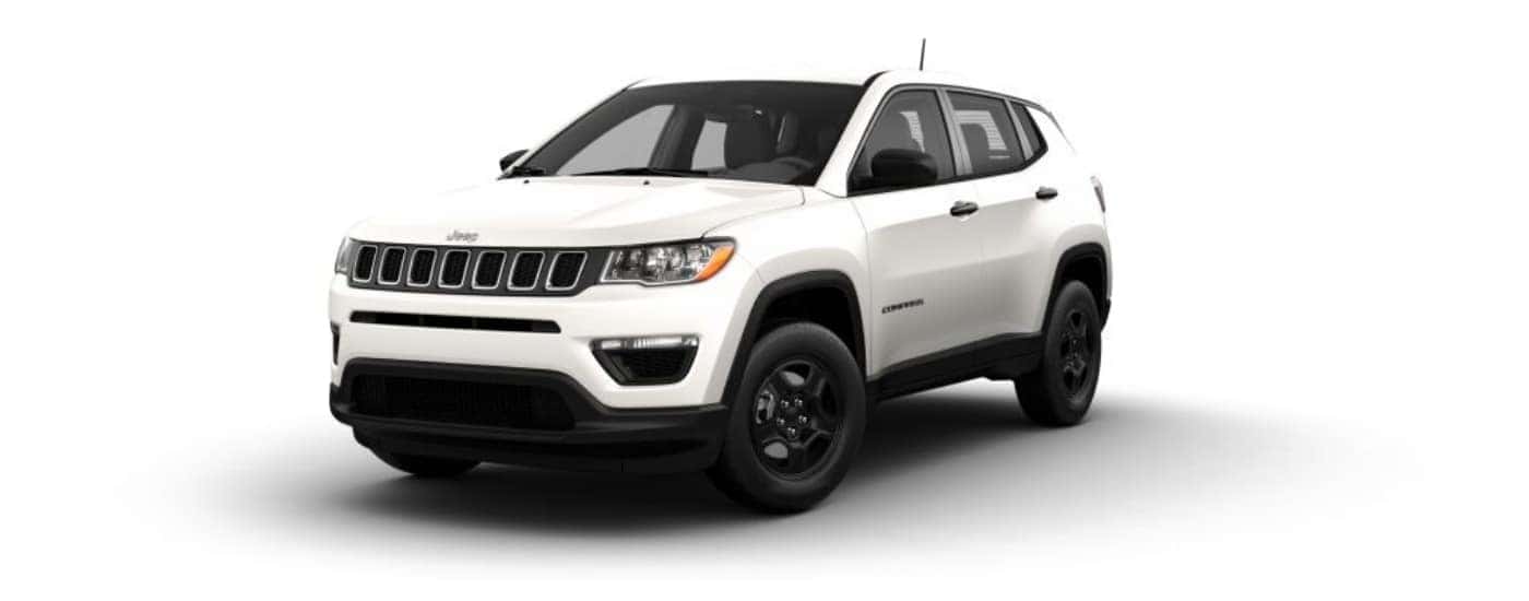 A white 2021 Jeep Compass Sport angled left.
