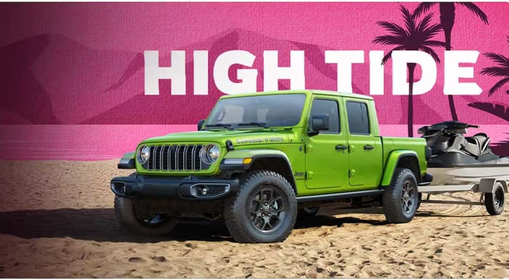 A green 2025 Jeep Gladiator High Tide parked on sand.