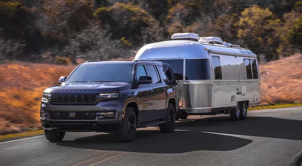 A grey 2025 Jeep Grand Wagoneer from the front at an angle.