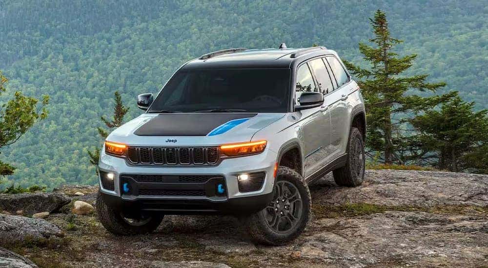 A light gray 2025 Jeep Grand Cherokee 4xe off-roading