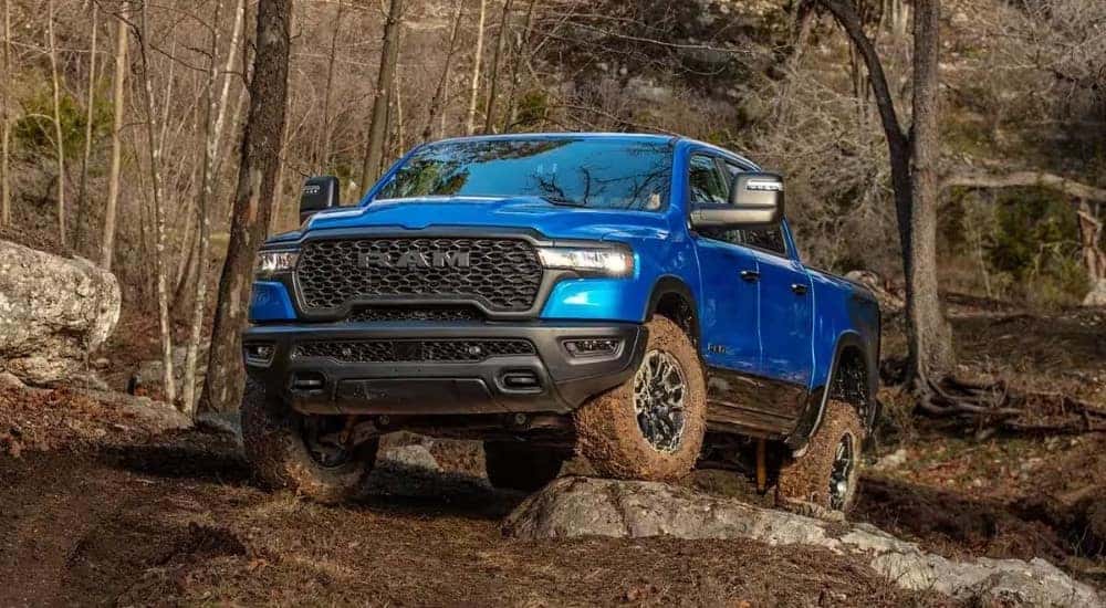 A blue 2026 Ram 1500 parked off-road