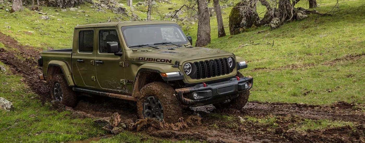 A green 2025 Jeep Gladiator Rubicon off-roading