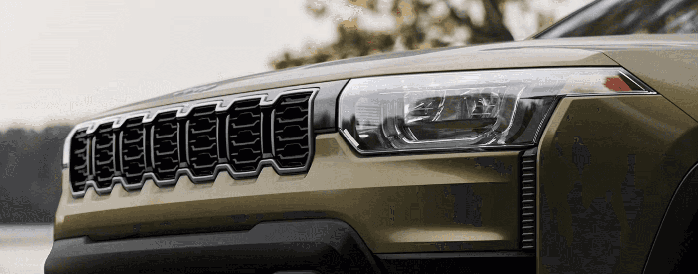 Front grille on a green 2026 Jeep Cherokee