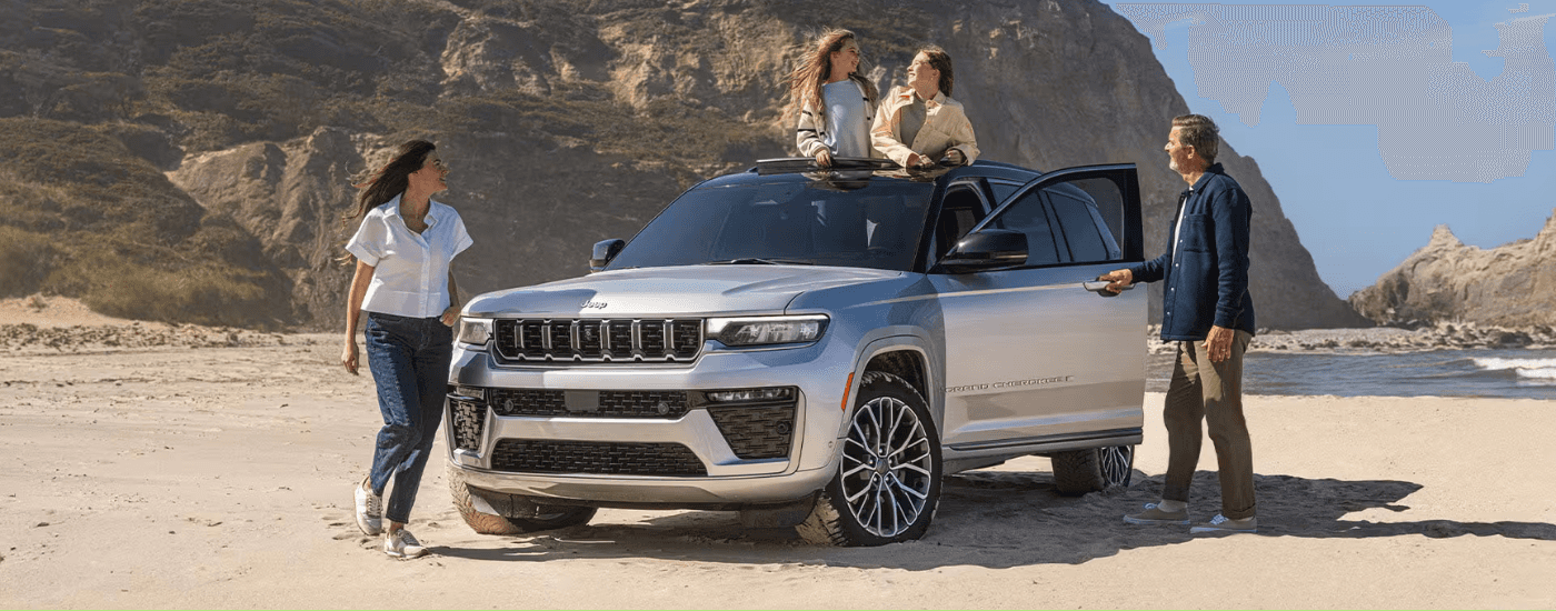 A family by their silver 2026 Jeep Grand Cherokee L