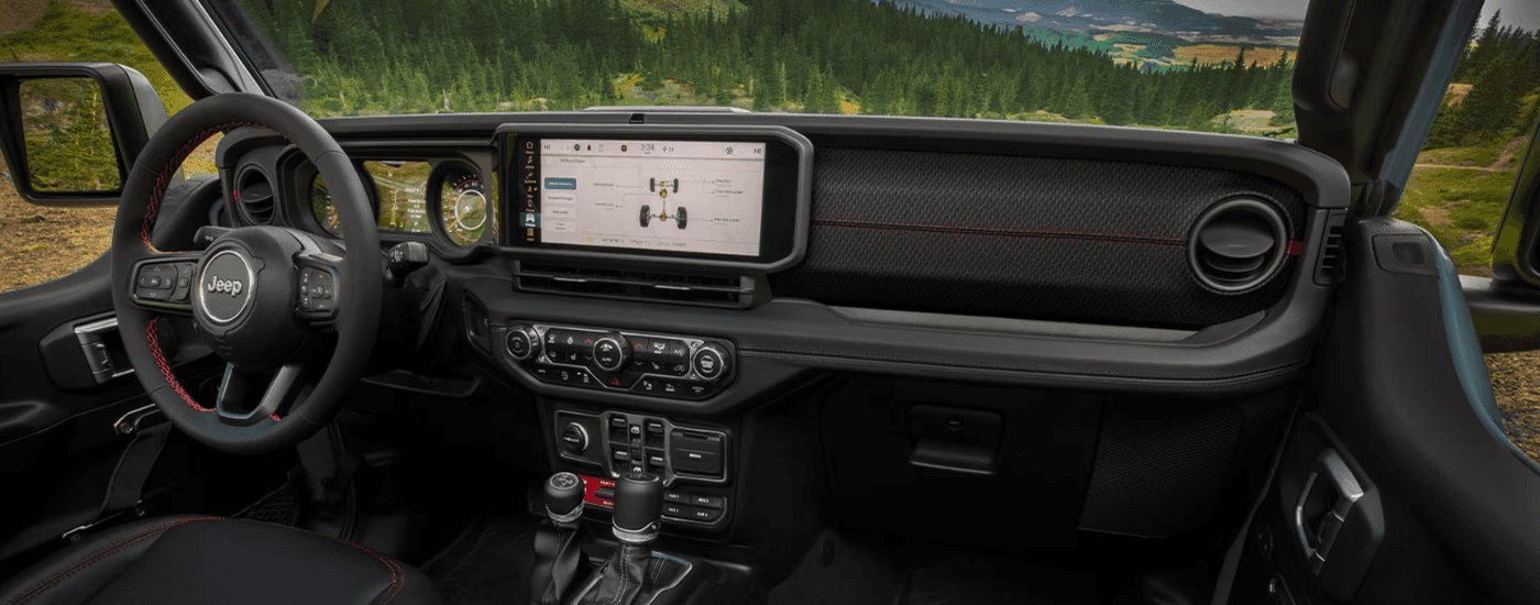 Interior of a 2025 Jeep Gladiator for sale near Independence showing the infotainment system