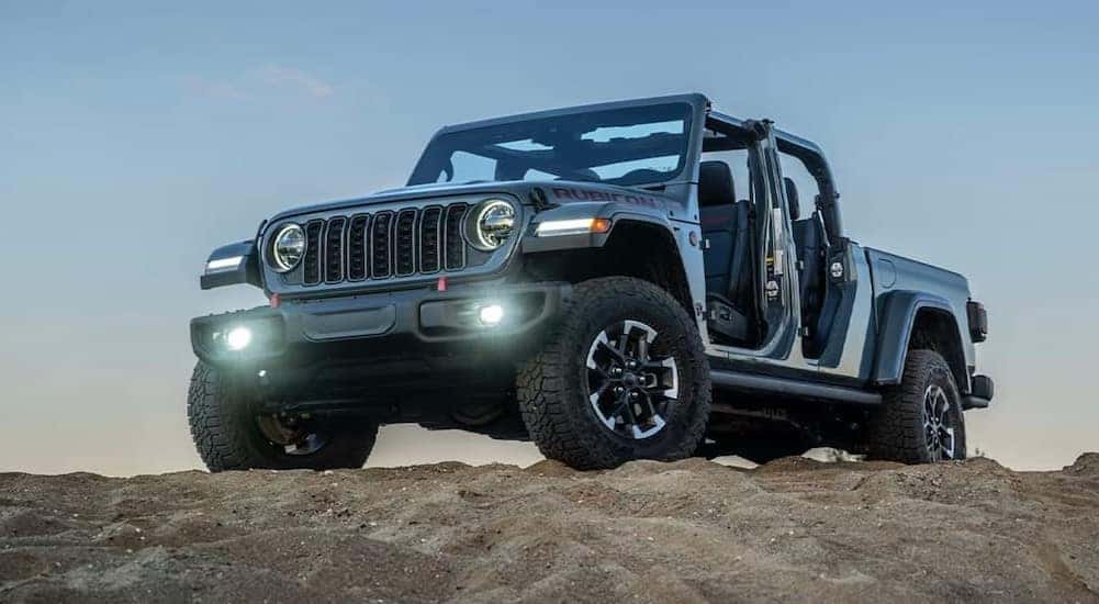 A blue 2026 Jeep Gladiator Rubicon parked on a hill.