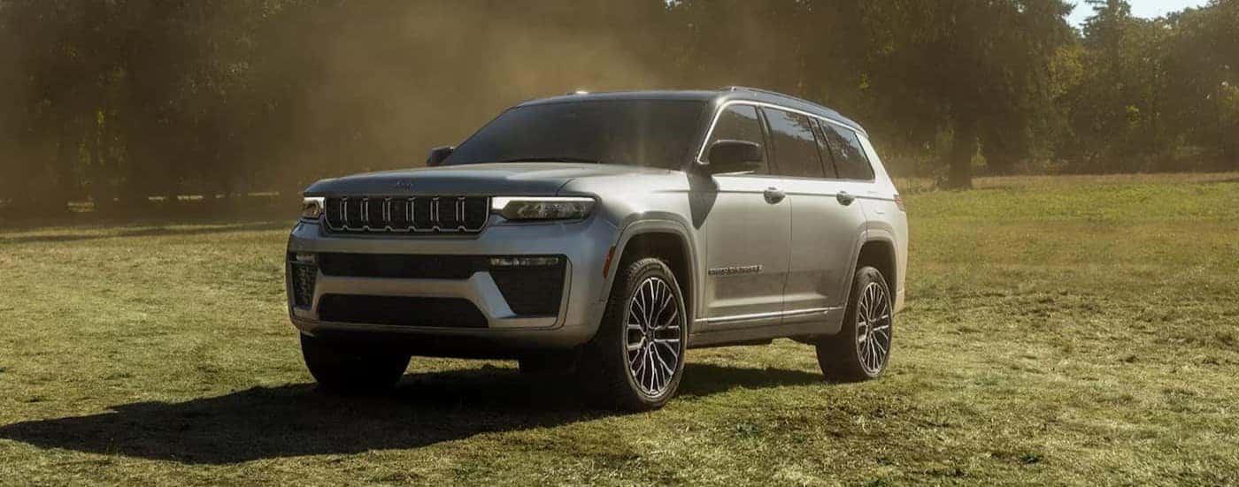 A parked silver 2026 Jeep Grand Cherokee for sale near Alexandria.