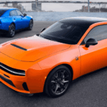 An orange and a blue 2026 Dodge Charges pair next to each other