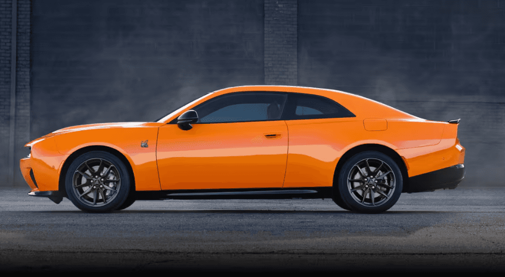 Side profile of an orange 2026 Dodge Charger