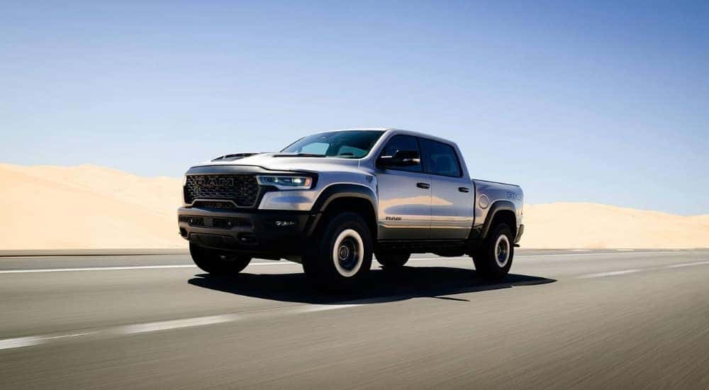 Silver 2026 Ram 1500 RHO driving to a Ram dealer near Cincinnati