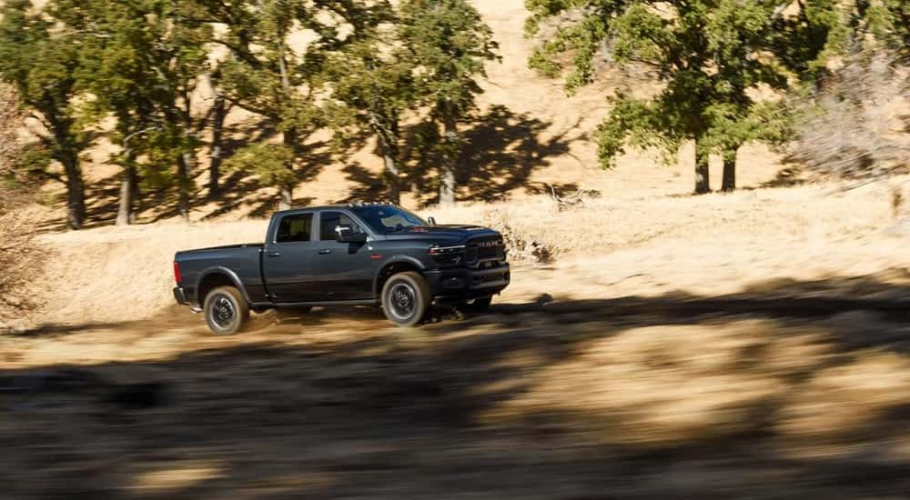 Black 2026 Ram 2500 driving to a Ram dealer near Norwood