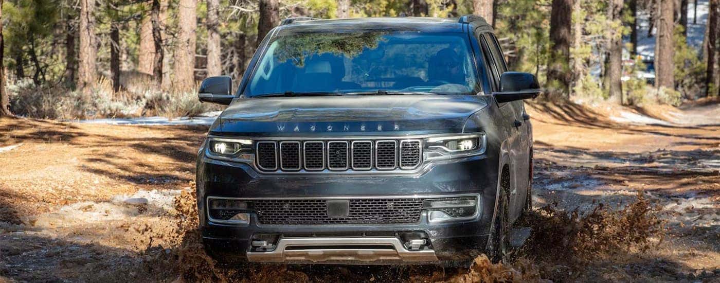 A black 2025 Jeep Wagoneer driving off-road