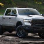 Grey 2026 Ram 1500 Rebel parked off-road on dirt
