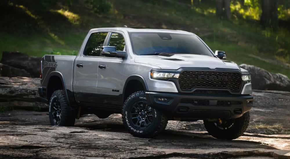 Grey 2026 Ram 1500 Rebel parked off-road on dirt