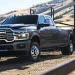 A gray 2026 Ram 3500 parked near a hill.
