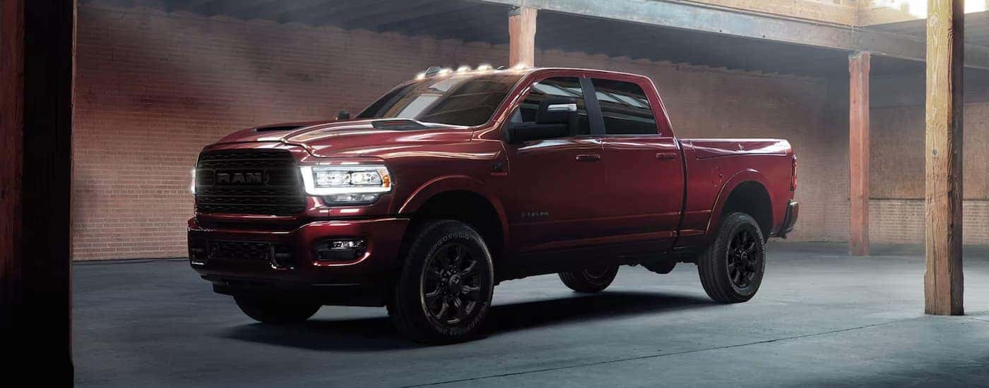 Red 2025 Ram 2500 parked in a parking garage.