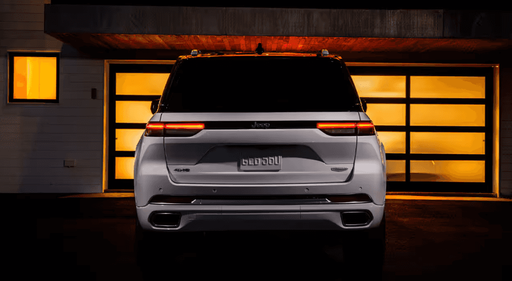 White 2026 Jeep Grand Cherokee parked in a driveway