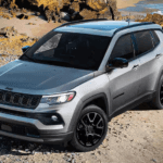 Silver 2026 Jeep Compass Latitude Altitude parked by the sea