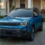 Blue 2026 Jeep Cherokee parked in a driveway