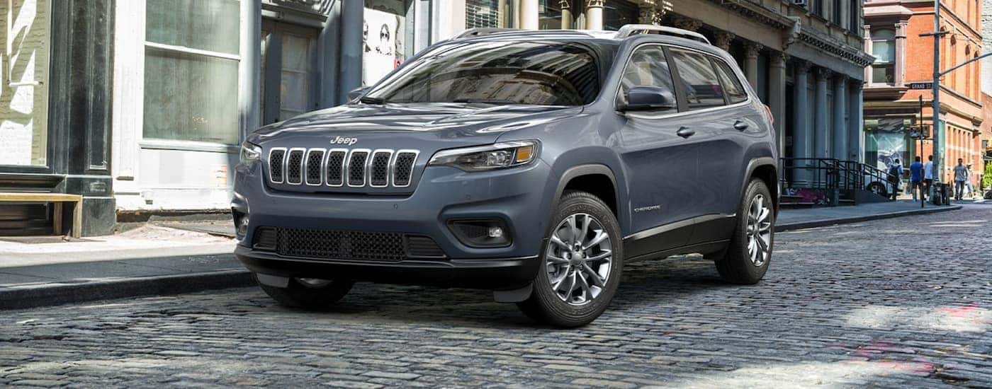 Grey 2021 Jeep Cherokee parked on a city street