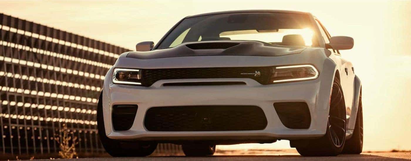 White 2021 Dodge Charger parked at sunset